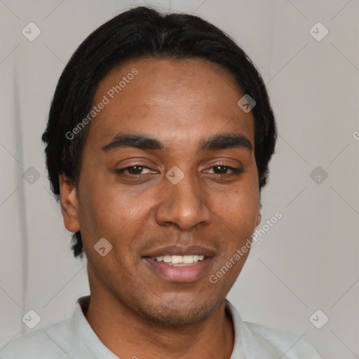 Joyful black young-adult male with short  black hair and brown eyes