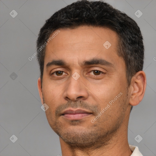 Neutral latino adult male with short  black hair and brown eyes