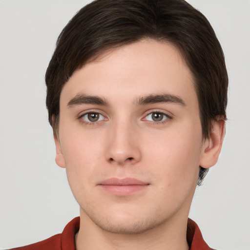 Neutral white young-adult male with short  brown hair and brown eyes