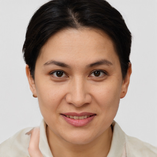 Joyful white adult female with short  brown hair and brown eyes