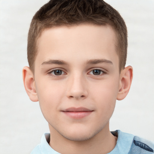 Joyful white child male with short  brown hair and brown eyes