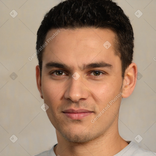 Joyful white young-adult male with short  black hair and brown eyes