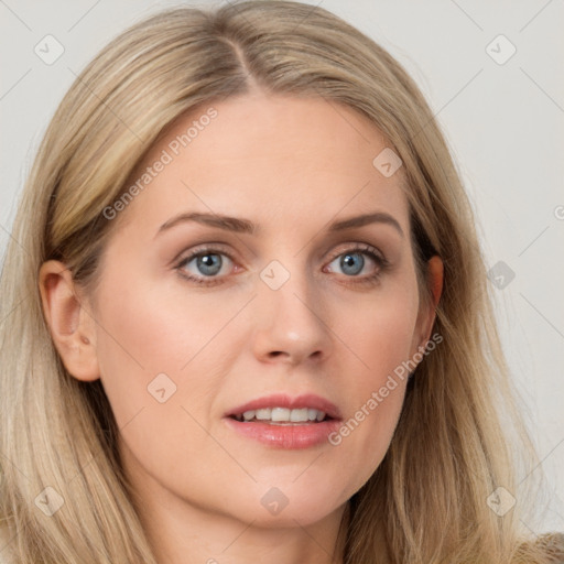 Joyful white young-adult female with long  brown hair and blue eyes