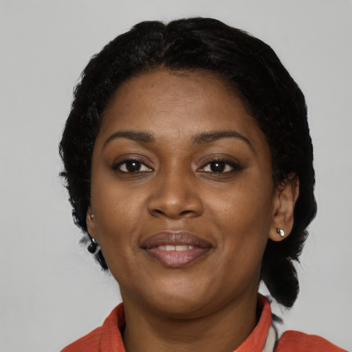 Joyful latino young-adult female with short  black hair and brown eyes