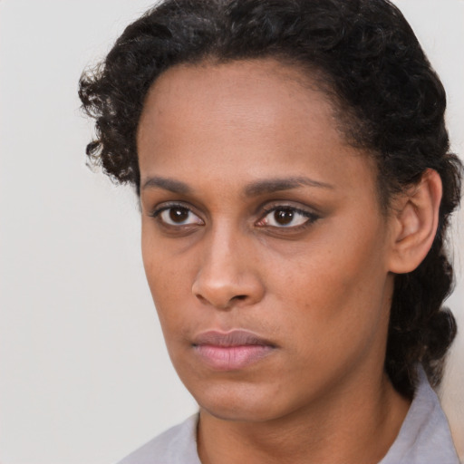 Neutral black young-adult female with short  brown hair and brown eyes