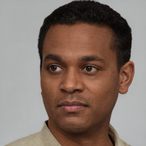 Neutral black young-adult male with short  black hair and brown eyes