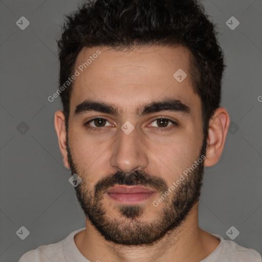 Joyful white young-adult male with short  black hair and brown eyes