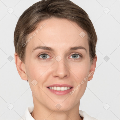 Joyful white young-adult female with short  brown hair and grey eyes