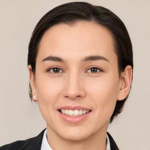 Joyful white young-adult female with medium  brown hair and brown eyes