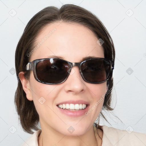 Joyful white young-adult female with medium  brown hair and blue eyes