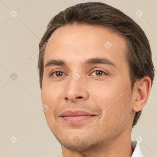 Joyful white adult male with short  brown hair and brown eyes