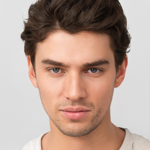 Neutral white young-adult male with short  brown hair and brown eyes