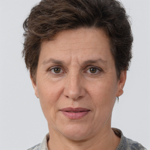 Joyful white adult female with short  brown hair and brown eyes