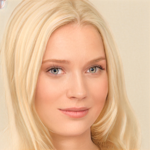 Joyful white young-adult female with long  blond hair and blue eyes