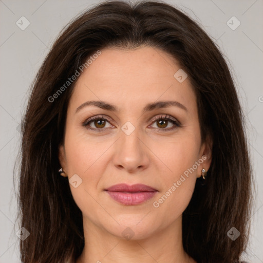 Joyful white adult female with long  brown hair and brown eyes