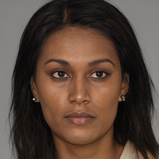 Joyful asian young-adult female with long  brown hair and brown eyes