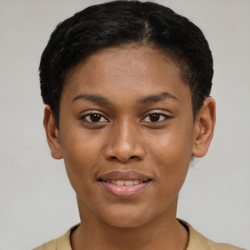 Joyful latino young-adult female with short  brown hair and brown eyes