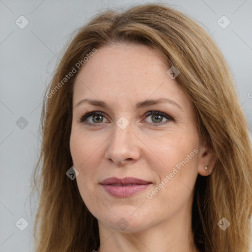 Joyful white adult female with long  brown hair and brown eyes