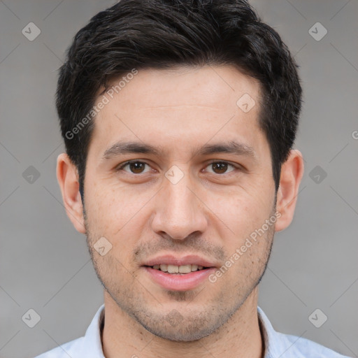 Joyful white young-adult male with short  black hair and brown eyes