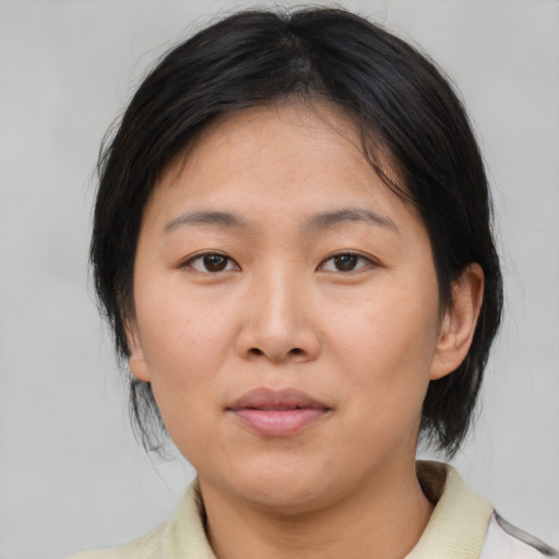 Neutral asian young-adult female with medium  brown hair and brown eyes