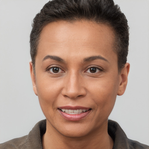 Joyful white adult female with short  brown hair and brown eyes