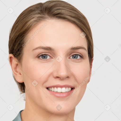 Joyful white young-adult female with short  brown hair and grey eyes