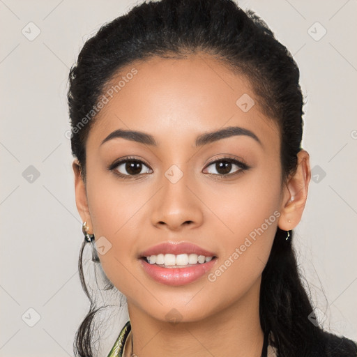 Joyful latino young-adult female with long  black hair and brown eyes