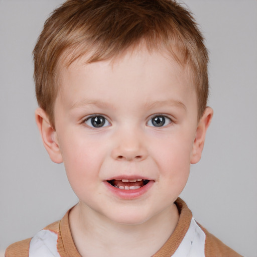 Joyful white child male with short  brown hair and brown eyes