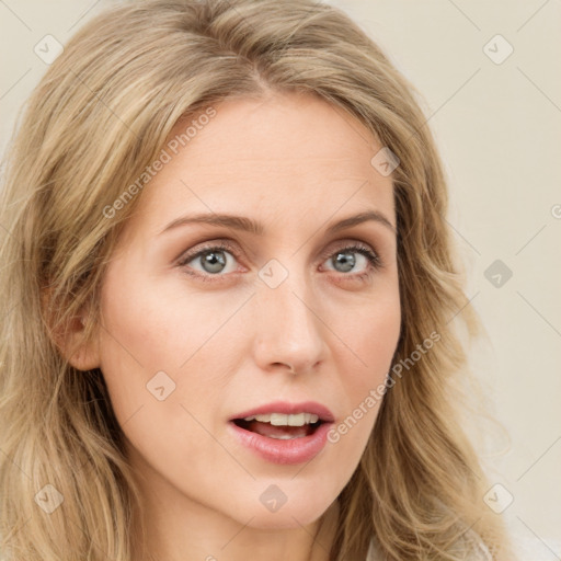 Joyful white young-adult female with long  brown hair and blue eyes