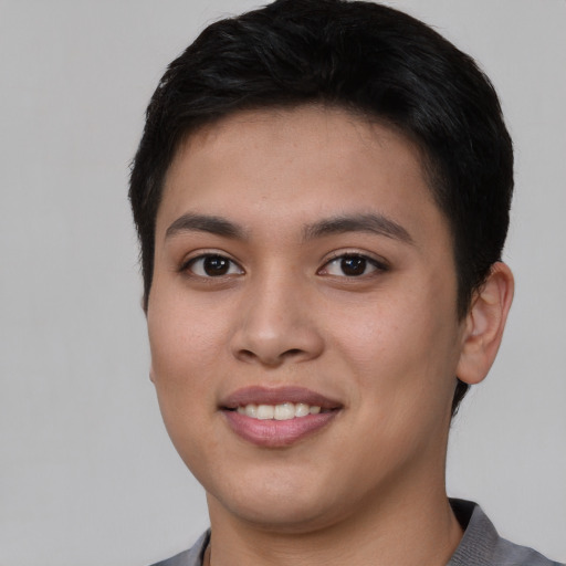 Joyful asian young-adult female with short  brown hair and brown eyes
