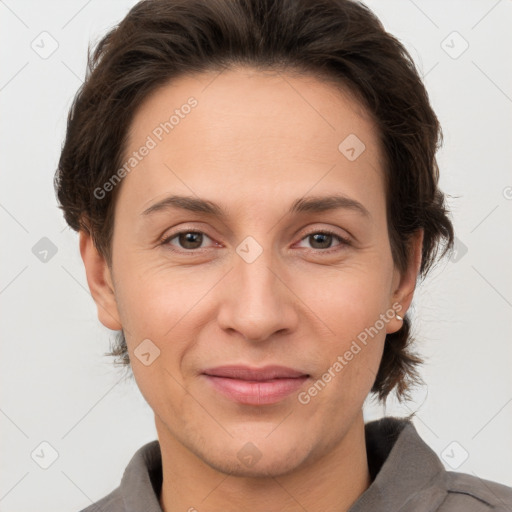 Joyful white adult female with short  brown hair and brown eyes