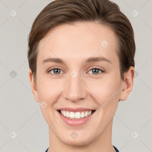 Joyful white young-adult female with short  brown hair and grey eyes