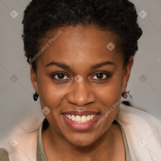 Joyful black young-adult female with short  brown hair and brown eyes