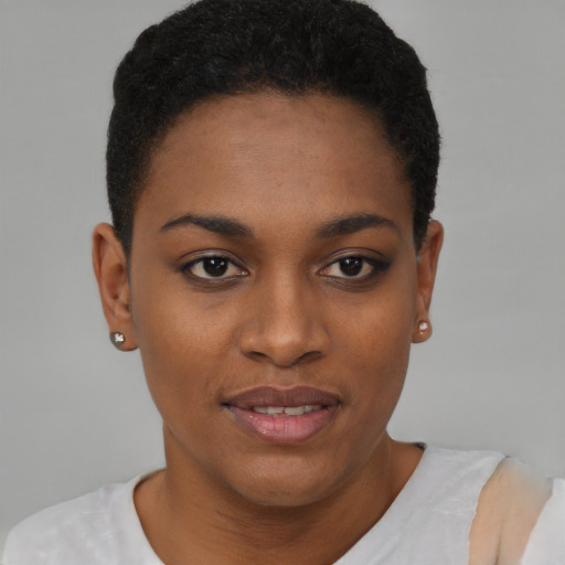 Joyful black young-adult female with short  brown hair and brown eyes