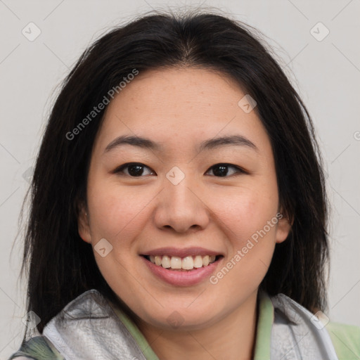 Joyful asian young-adult female with medium  brown hair and brown eyes