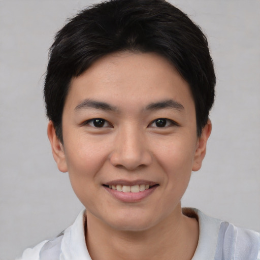 Joyful white young-adult female with short  black hair and brown eyes