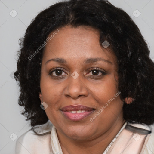 Joyful black adult female with medium  brown hair and brown eyes