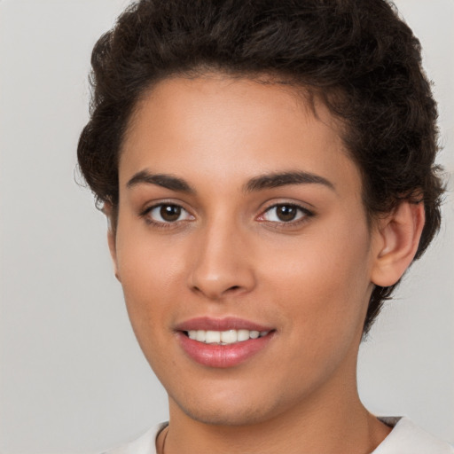 Joyful white young-adult female with short  brown hair and brown eyes