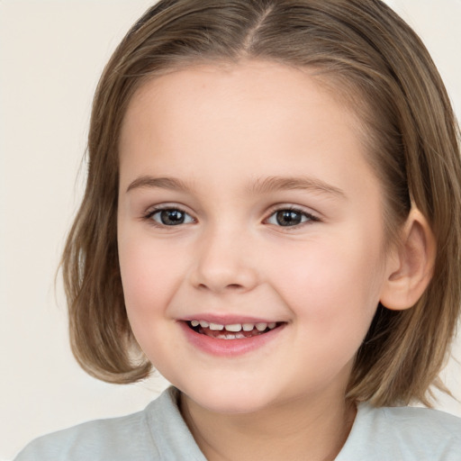 Joyful white child female with medium  brown hair and brown eyes