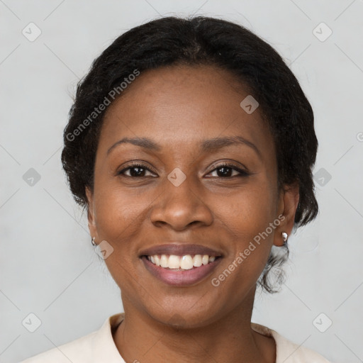 Joyful black young-adult female with medium  brown hair and brown eyes