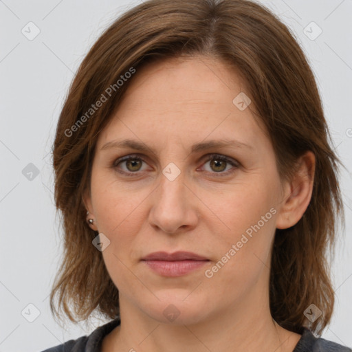 Joyful white adult female with medium  brown hair and brown eyes