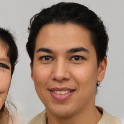 Joyful white young-adult male with medium  brown hair and brown eyes