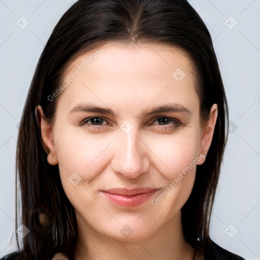 Joyful white young-adult female with long  brown hair and brown eyes