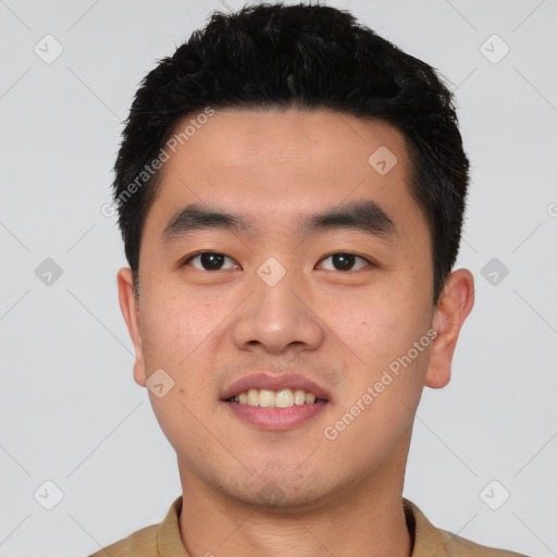 Joyful asian young-adult male with short  black hair and brown eyes