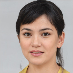 Joyful asian young-adult female with short  brown hair and brown eyes