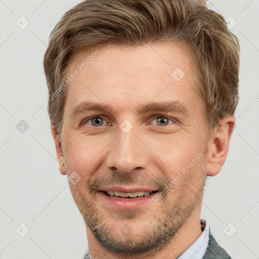 Joyful white adult male with short  brown hair and grey eyes