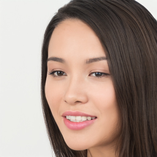 Joyful white young-adult female with long  black hair and brown eyes