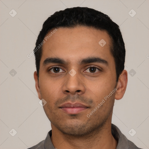 Neutral latino young-adult male with short  black hair and brown eyes