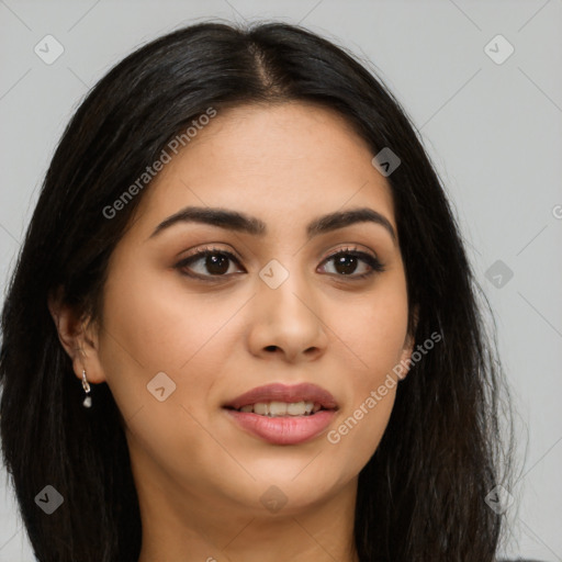 Joyful latino young-adult female with long  brown hair and brown eyes