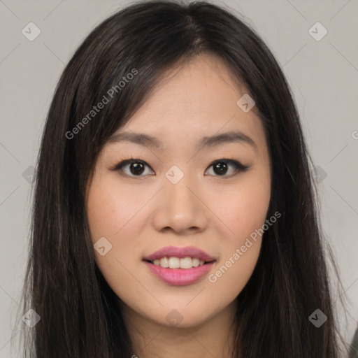 Joyful asian young-adult female with long  brown hair and brown eyes